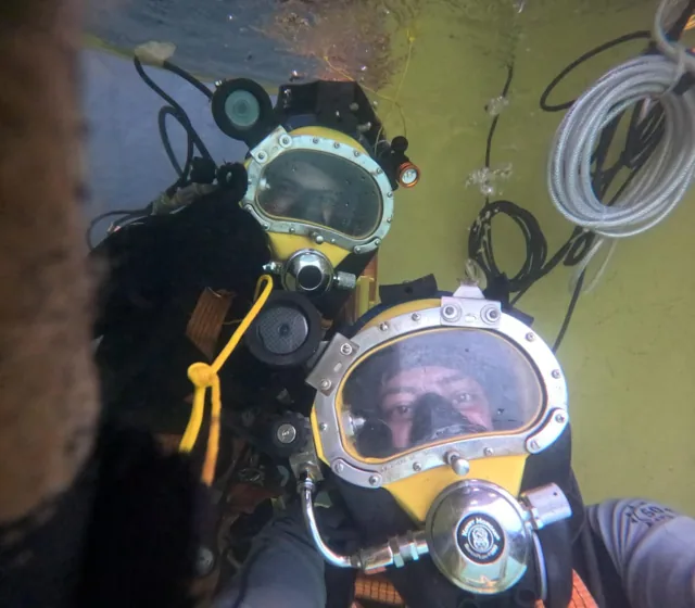 Two equipped commercial divers during an Atlas underwater operation.
